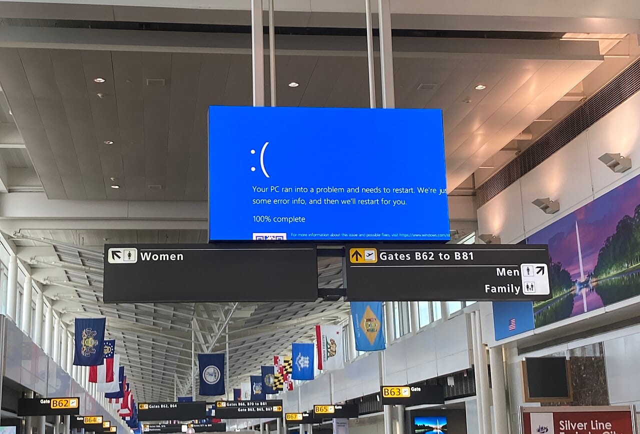 Blue-screen error messages on flight information displays at Washington Dulles International Airport on the morning of the CrowdStrike outage.