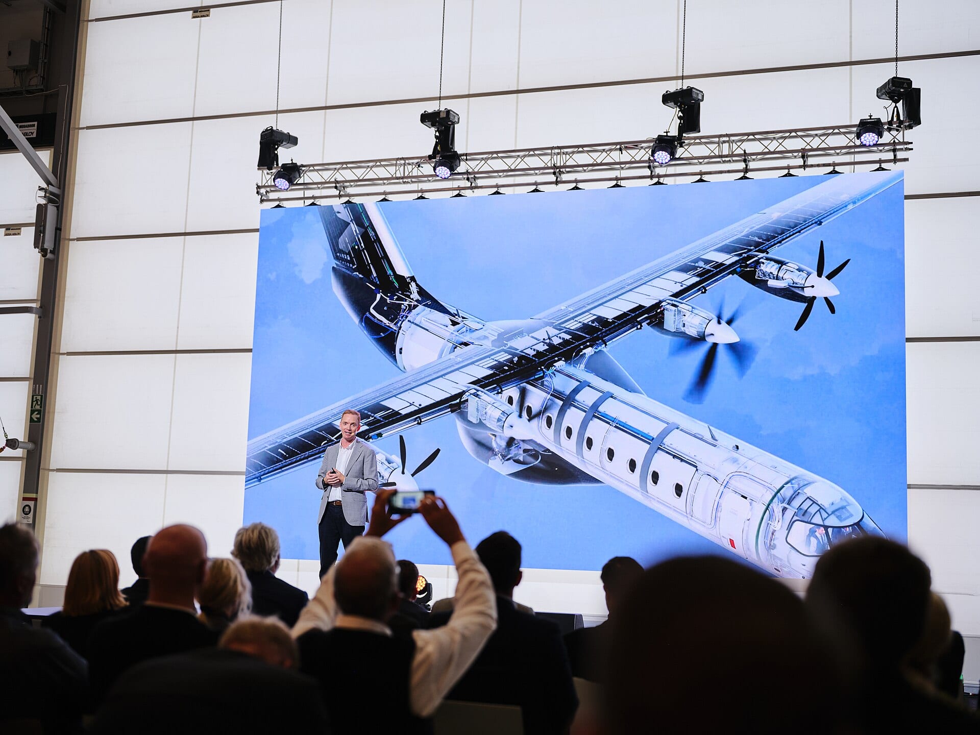 Heart Aerospace CEO Anders Forslund presenting a cutaway rendering of the ES-30’s hybrid-electric propulsion system at the company’s 2024 Hangar Day event.