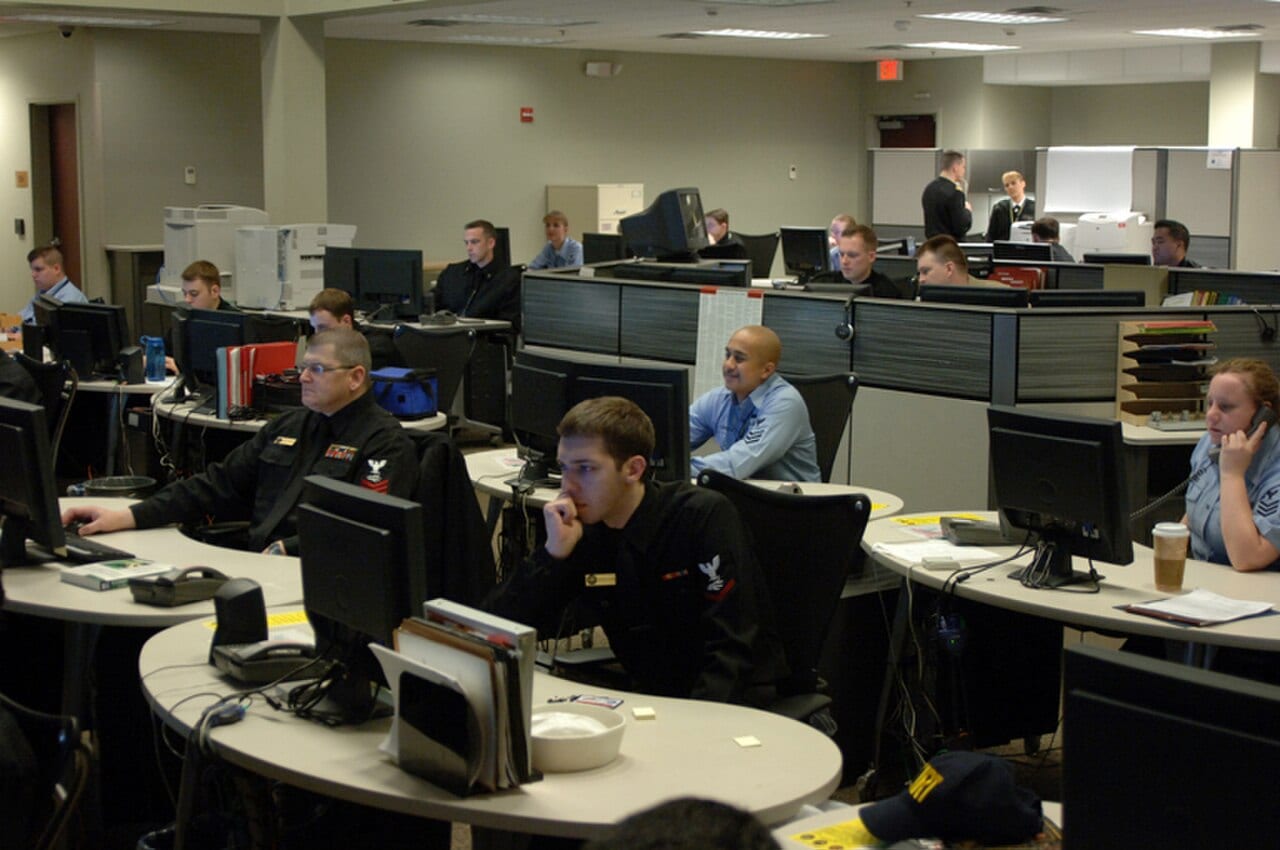 Sailors on the watch floor of the Navy Cyber Defense Operations Command monitoring screens for unauthorized network activity.